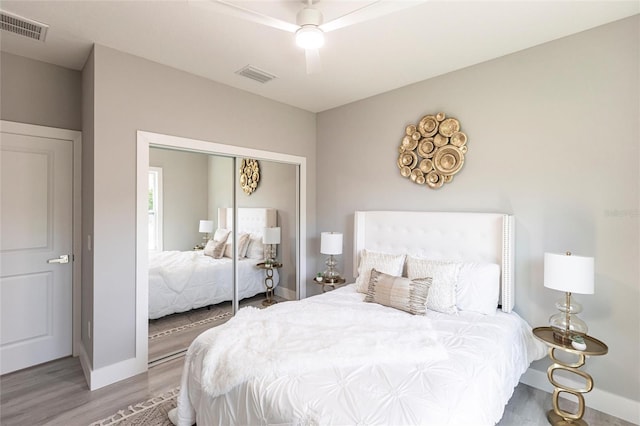 14350 Marlin Ave, Port Charlotte, FL 33953 - bedroom featuring wood finished floors, baseboards, a closet, and ceiling fan