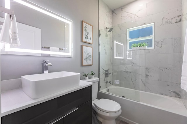 14350 Marlin Ave, Port Charlotte, FL 33953 - bathroom featuring toilet, vanity, and bathtub / shower combination