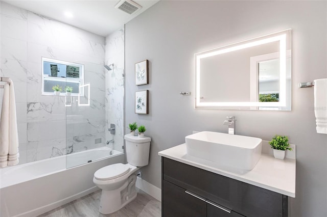 14350 Marlin Ave, Port Charlotte, FL 33953 - full bath featuring toilet, vanity, tub / shower combination, and plenty of natural light