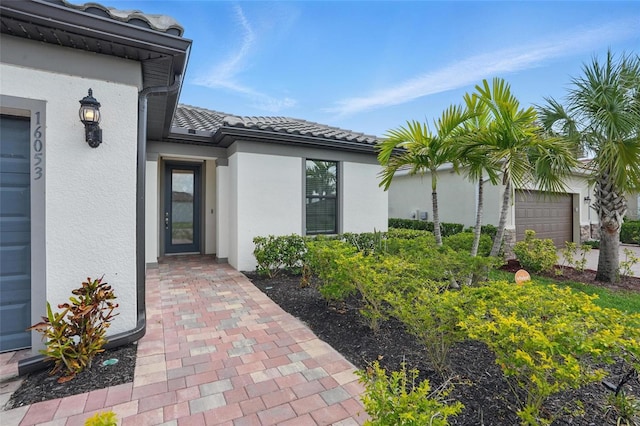 16053 Rosemallow Ln, Alva, FL 33920 - entrance to property featuring stucco siding and a tile roof