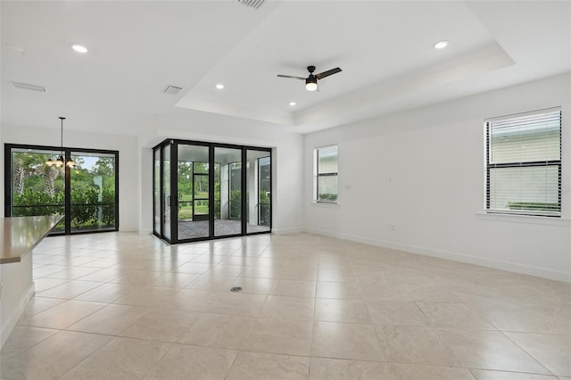 16053 Rosemallow Ln, Alva, FL 33920 - spare room featuring a raised ceiling, plenty of natural light, baseboards, and recessed lighting