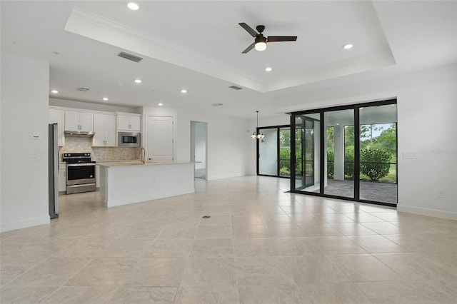 16053 Rosemallow Ln, Alva, FL 33920 - unfurnished living room with a tray ceiling, ceiling fan, baseboards, ornamental molding, and recessed lighting