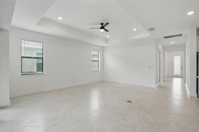 16053 Rosemallow Ln, Alva, FL 33920 - spare room featuring a raised ceiling, ceiling fan, baseboards, light tile patterned floors, and recessed lighting