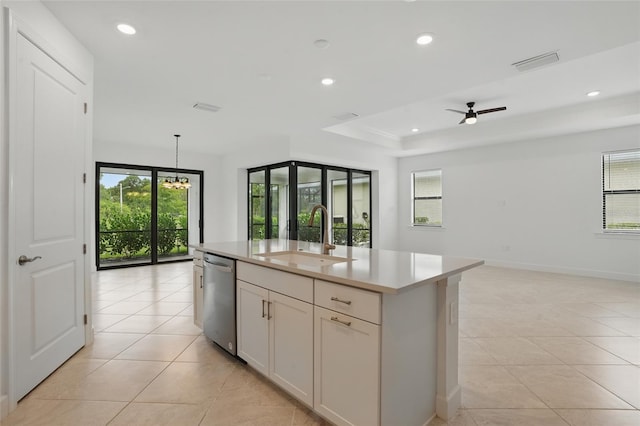 16053 Rosemallow Ln, Alva, FL 33920 - kitchen with stainless steel dishwasher, a sink, open floor plan, light tile patterned floors, and recessed lighting