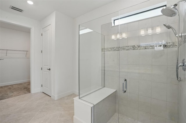 16053 Rosemallow Ln, Alva, FL 33920 - full bath featuring a stall shower, a spacious closet, and baseboards