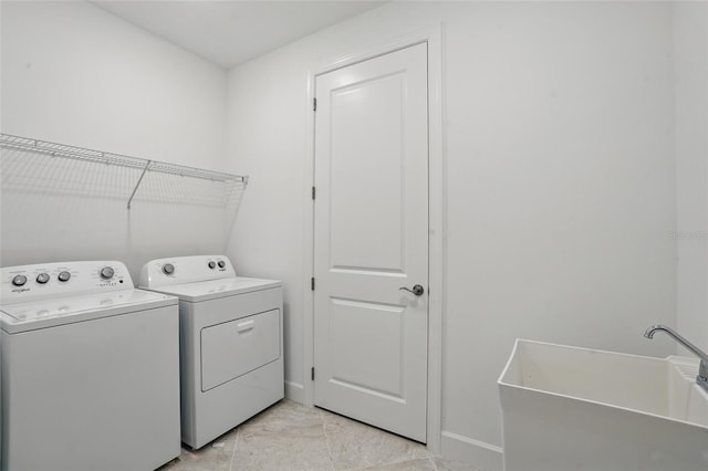 16053 Rosemallow Ln, Alva, FL 33920 - washroom with washing machine and dryer and baseboards