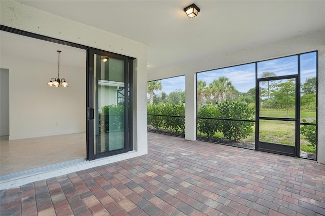 16053 Rosemallow Ln, Alva, FL 33920 - unfurnished sunroom with a chandelier and plenty of natural light