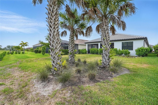 16053 Rosemallow Ln, Alva, FL 33920 - view of front of home with stucco siding, a front yard, and a tile roof