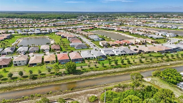 16053 Rosemallow Ln, Alva, FL 33920 - aerial view of property and surrounding area with a large body of water and nearby suburban area