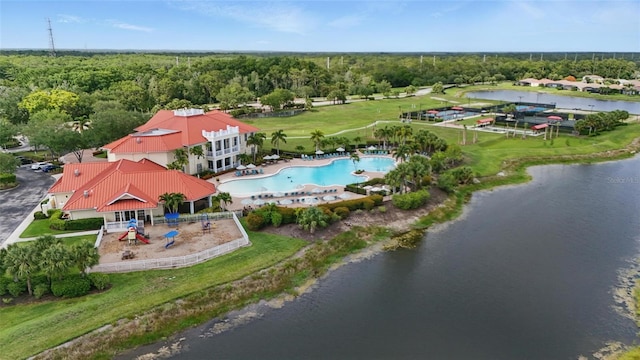 16053 Rosemallow Ln, Alva, FL 33920 - bird's eye view of a pool, a large body of water, and a heavily wooded area