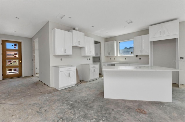 12299 Albrecht Ter, Port Charlotte, FL 33981 - kitchen featuring a center island and white cabinets