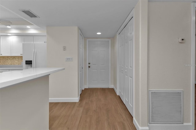 601 Shreve St Unit 64C, Punta Gorda, FL 33950 - corridor with light wood finished floors, baseboards, and recessed lighting