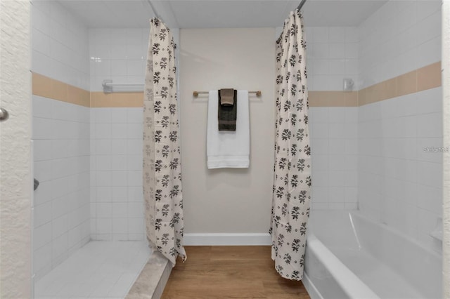 601 Shreve St Unit 64C, Punta Gorda, FL 33950 - full bath featuring wood finished floors, baseboards, and tiled shower / bath