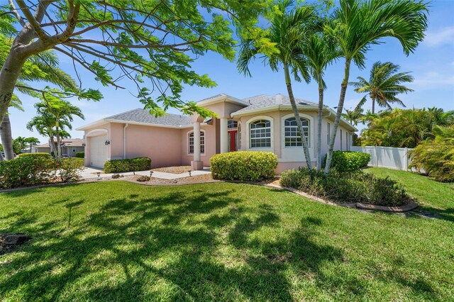 3219 SW 7th Ln, Cape Coral, FL 33991 - ranch-style house featuring stucco siding and a garage