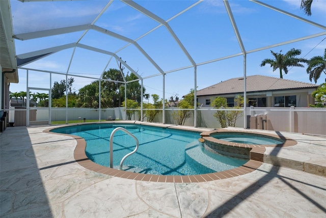 3219 SW 7th Ln, Cape Coral, FL 33991 - view of swimming pool featuring a patio, a pool with connected hot tub, and a lanai