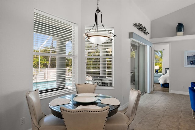 3219 SW 7th Ln, Cape Coral, FL 33991 - dining room with plenty of natural light, high vaulted ceiling, baseboards, and tile patterned flooring