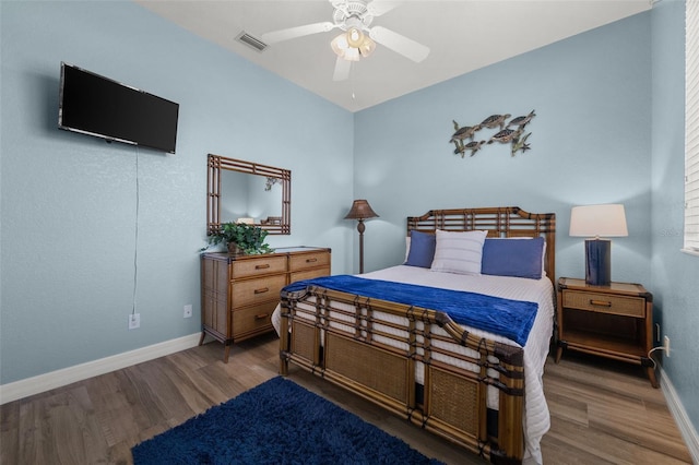 3219 SW 7th Ln, Cape Coral, FL 33991 - bedroom featuring wood finished floors, baseboards, and ceiling fan