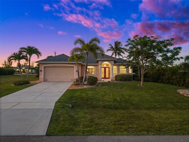 3219 SW 7th Ln, Cape Coral, FL 33991 - ranch-style house featuring stucco siding, a garage, driveway, and a front yard
