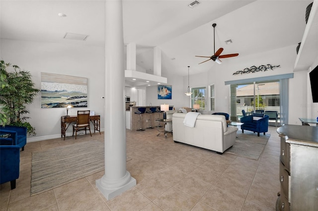 3219 SW 7th Ln, Cape Coral, FL 33991 - living room featuring decorative columns, ceiling fan, high vaulted ceiling, and light tile patterned flooring