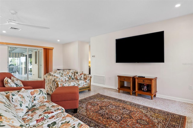 125 Small St SE, Port Charlotte, FL 33952 - living area with baseboards, recessed lighting, a ceiling fan, and carpet