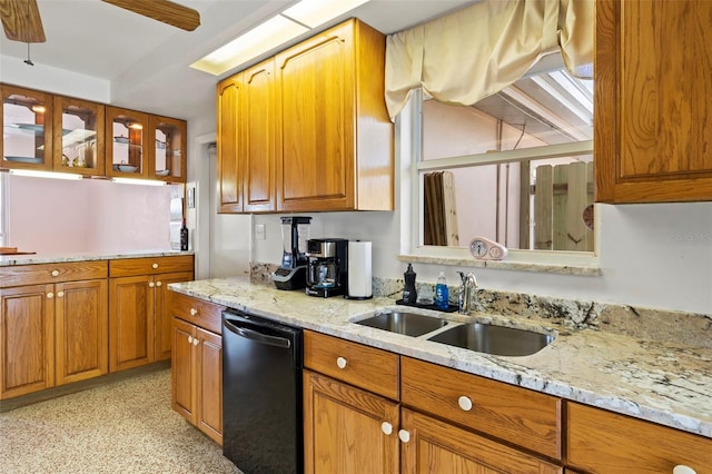 125 Small St SE, Port Charlotte, FL 33952 - kitchen with black dishwasher, a sink, brown cabinetry, light stone countertops, and ceiling fan