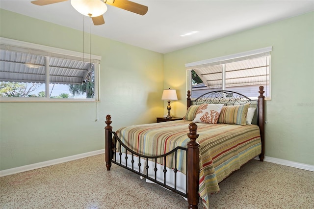 125 Small St SE, Port Charlotte, FL 33952 - bedroom with baseboards, speckled floor, and ceiling fan