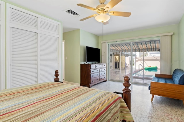 125 Small St SE, Port Charlotte, FL 33952 - bedroom featuring dark speckled floor, access to exterior, ceiling fan, a closet, and baseboards