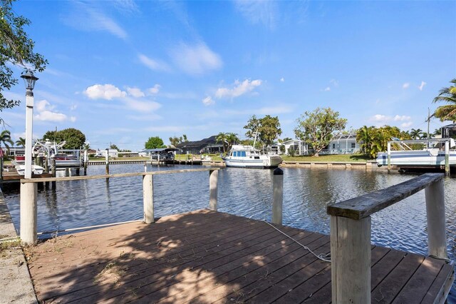 125 Small St SE, Port Charlotte, FL 33952 - dock area featuring a water view