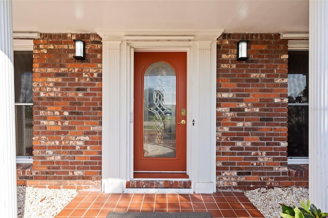 125 Small St SE, Port Charlotte, FL 33952 - entrance to property featuring brick siding and covered porch