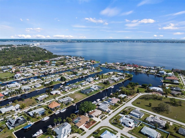 125 Small St SE, Port Charlotte, FL 33952 - aerial view of property and surrounding area featuring a nearby body of water and nearby suburban area