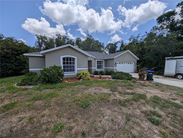 4205 Simkins Ave, North Port, FL 34286 - ranch-style home featuring stucco siding, an attached garage, and driveway
