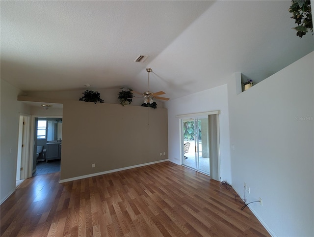4205 Simkins Ave, North Port, FL 34286 - empty room featuring ceiling fan, lofted ceiling, wood finished floors, and baseboards
