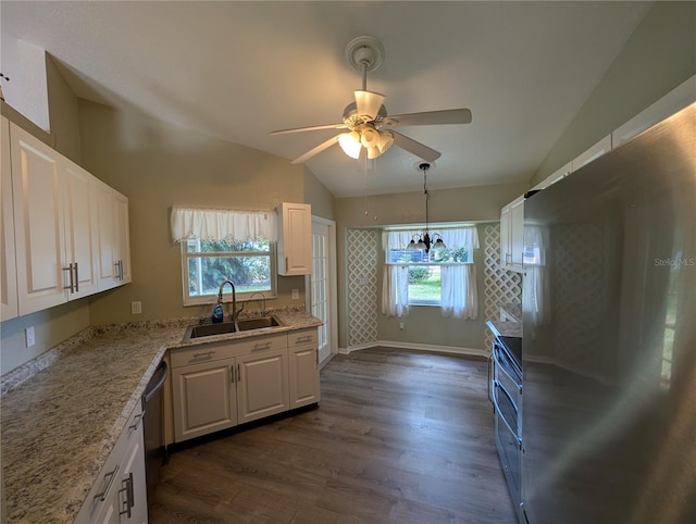 4205 Simkins Ave, North Port, FL 34286 - kitchen featuring appliances with stainless steel finishes, a sink, vaulted ceiling, a ceiling fan, and dark wood-style flooring