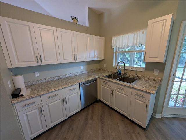 4205 Simkins Ave, North Port, FL 34286 - kitchen featuring dishwasher, a sink, dark wood finished floors, and white cabinets