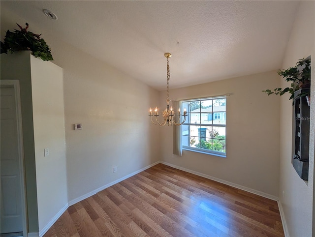 4205 Simkins Ave, North Port, FL 34286 - unfurnished dining area with light wood-type flooring, a chandelier, and baseboards
