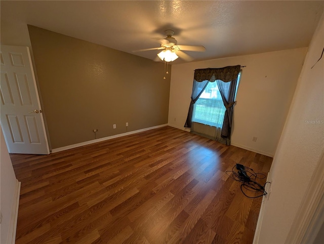 4205 Simkins Ave, North Port, FL 34286 - empty room with wood finished floors, ceiling fan, and baseboards