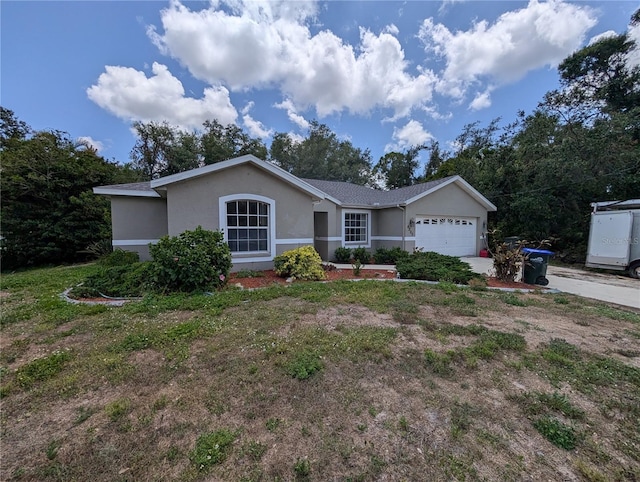 4205 Simkins Ave, North Port, FL 34286 - single story home featuring stucco siding, a garage, and driveway