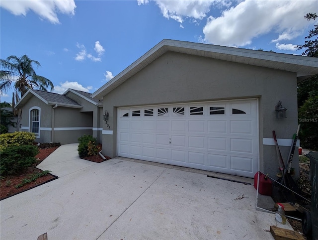 4205 Simkins Ave, North Port, FL 34286 - ranch-style house with stucco siding, concrete driveway, and a garage