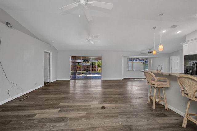 1210 Mccrory St, North Port, FL 34286 - living area featuring vaulted ceiling, ceiling fan, wood finished floors, baseboards, and recessed lighting