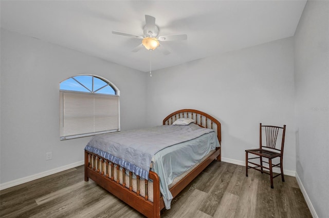 1210 Mccrory St, North Port, FL 34286 - bedroom with wood finished floors, baseboards, and a ceiling fan