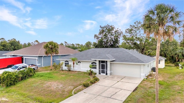 1210 Mccrory St, North Port, FL 34286 - ranch-style home featuring a garage, a front yard, concrete driveway, a shingled roof, and stucco siding