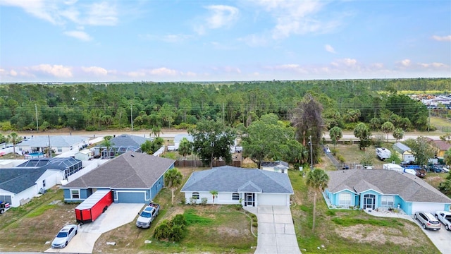 1210 Mccrory St, North Port, FL 34286 - aerial view of residential area featuring a heavily wooded area