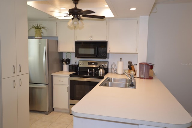 12538 SW Kingsway Cir Unit 1602, Lake Suzy, FL 34269 - kitchen featuring appliances with stainless steel finishes, a sink, a peninsula, light countertops, and recessed lighting