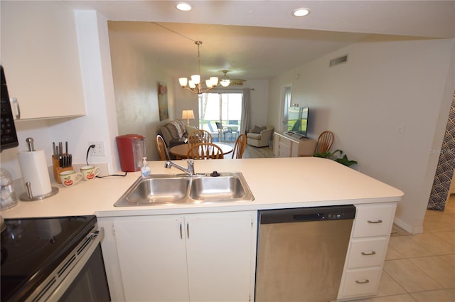 12538 SW Kingsway Cir Unit 1602, Lake Suzy, FL 34269 - kitchen featuring appliances with stainless steel finishes, a sink, a peninsula, light countertops, and recessed lighting