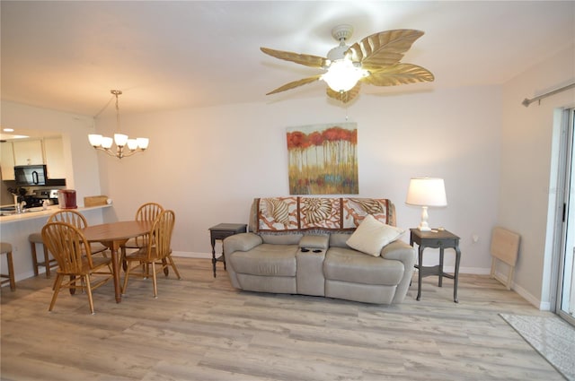 12538 SW Kingsway Cir Unit 1602, Lake Suzy, FL 34269 - living room featuring light wood-style floors, a chandelier, and baseboards