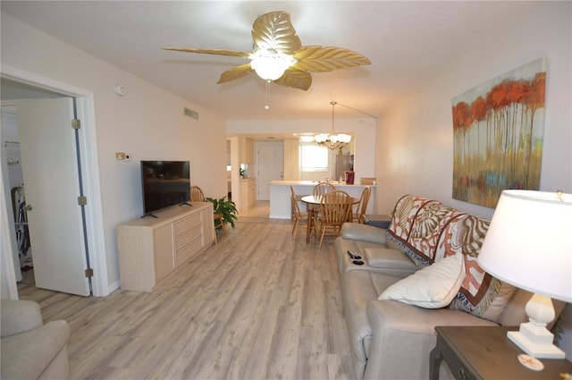 12538 SW Kingsway Cir Unit 1602, Lake Suzy, FL 34269 - living area featuring light wood-style floors, a chandelier, and ceiling fan