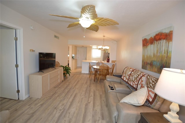 12538 SW Kingsway Cir Unit 1602, Lake Suzy, FL 34269 - living room featuring light wood-type flooring, ceiling fan, and a chandelier