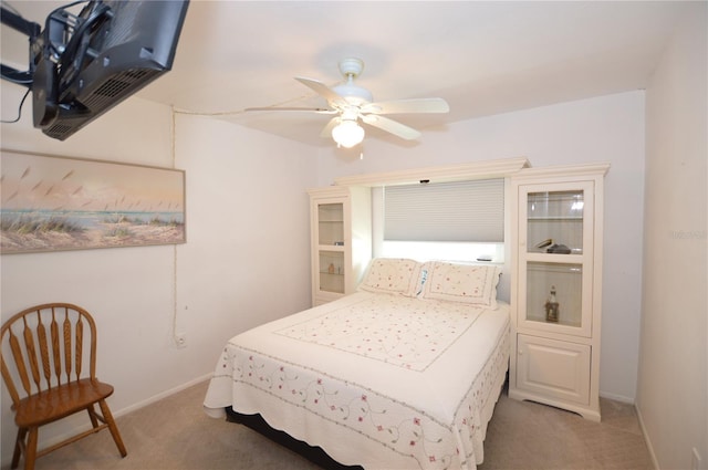 12538 SW Kingsway Cir Unit 1602, Lake Suzy, FL 34269 - bedroom featuring light carpet, baseboards, and a ceiling fan