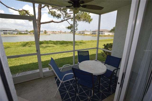 12538 SW Kingsway Cir Unit 1602, Lake Suzy, FL 34269 - sunroom featuring a water view, ceiling fan, and a residential view
