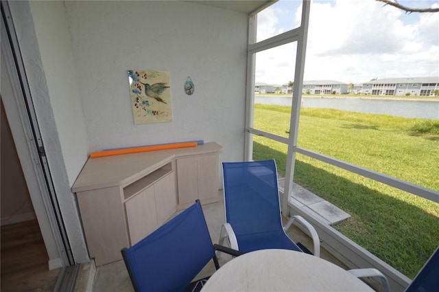 12538 SW Kingsway Cir Unit 1602, Lake Suzy, FL 34269 - sunroom / solarium with a water view